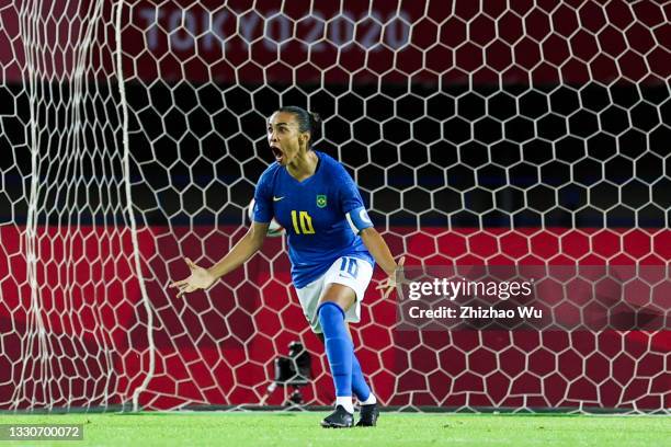 Marta of Brazil celebrates her scoring by penalty shots during the Women's First Round Group F match on day one of the Tokyo 2020 Olympic Games at...