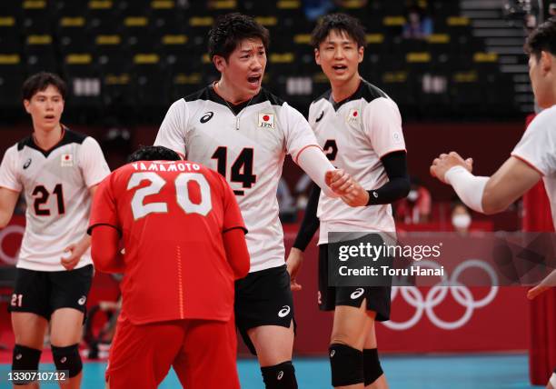 Yuki Ishikawa of Team Japan reacts with team mates as they compete against Team Canada during the Men's Preliminary Round - Pool A volleyball on day...