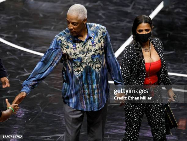 Head coach Julius "Dr. J" Erving of Tri-State and his wife Dorys Erving leave the court after a game against Ghost Ballers during the third week of...