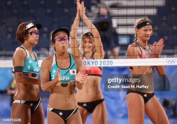 Miki Ishii and Megumi Murakami of Team Japan react with Laura Ludwig and Margareta Kozuch of Team Germany during the Women's Preliminary - Pool F...