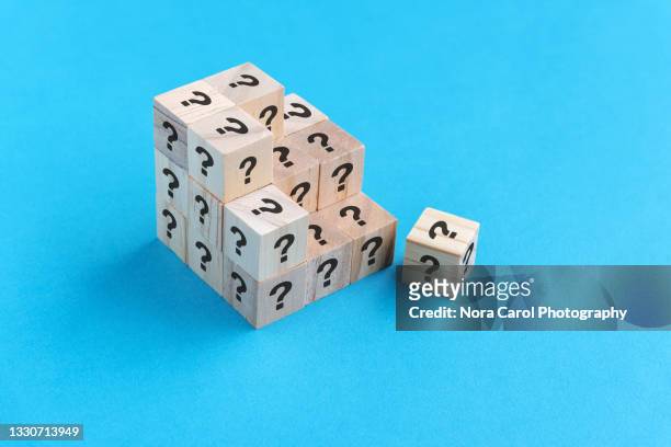 question mark wood cube on blue background - q and a stock pictures, royalty-free photos & images