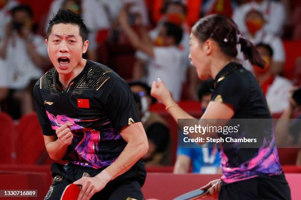 Xu Xin and Liu Shiwen of Team China react during their Mixed Doubles Gold Medal match on day three of the Tokyo 2020 Olympic Games at Tokyo...