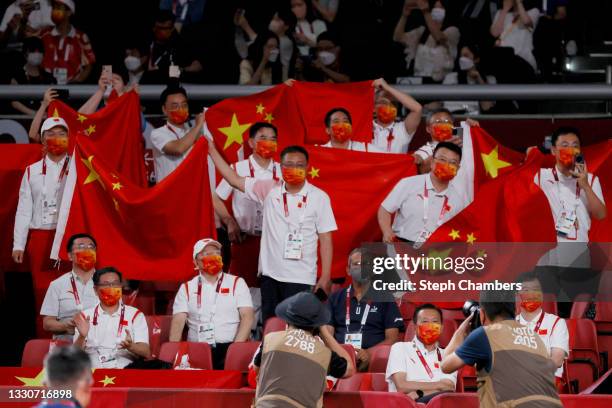 Team China supporters show their support during the Mixed Doubles Gold Medal match on day three of the Tokyo 2020 Olympic Games at Tokyo Metropolitan...