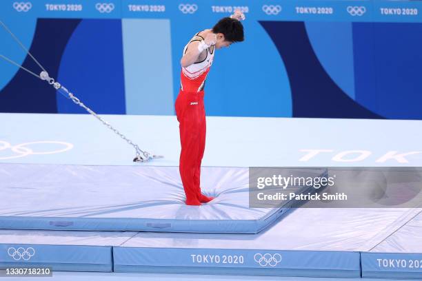 Daiki Hashimoto of Team Japan reacts after competing on horizontal bar during the Men's Team Final on day three of the Tokyo 2020 Olympic Games at...