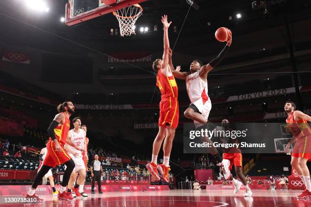 Rui Hachimura of Team Japan drives to the basket against Pau Gasol of Team Spain during the first half of the Men's Preliminary Round Group C game on...