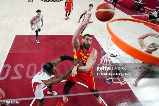 Marc Gasol of Team Spain drives to the basket against Rui Hachimura of Team Japan during the second half of the Men's Preliminary Round Group C game...