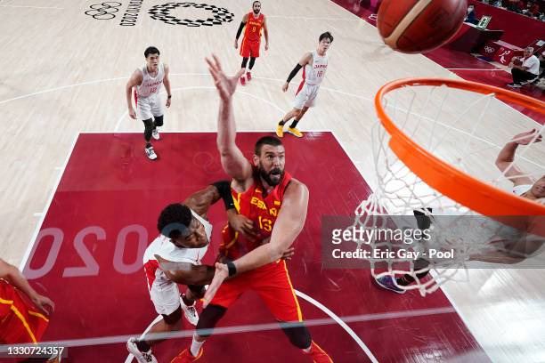 Marc Gasol of Team Spain drives to the basket against Rui Hachimura of Team Japan during the second half of the Men's Preliminary Round Group C game...