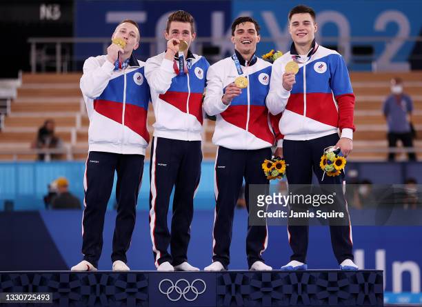 Denis Abliazin, David Belyavskiy, Artur Dalaloyan and Nikita Nagornyy of Team ROC pose with the gold medal on the podium during the medal ceremony...