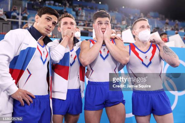 Artur Dalaloyan, David Belyavskiy, Nikita Nagornyy and Denis Abliazin of Team ROC react after winning the gold medal in the Men's Team Final on day...