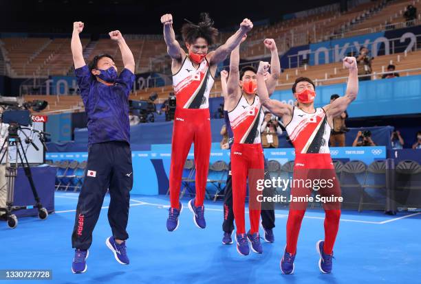 Kazuma Kaya, Wataru Tanigawa and Takeru Kitazono of Team Japan react after winning the silver medal in the Men's Team Final on day three of the Tokyo...