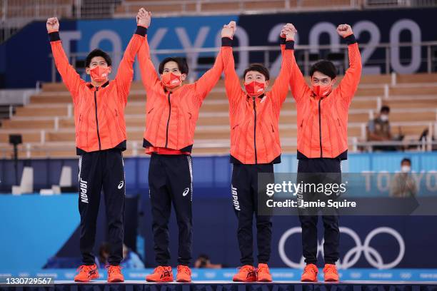 Daiki Hashimoto, Kazuma Kaya, Takeru Kitazono, and Wataru Tanigawa of Team Japan react during the medal ceremony after winning the silver medal in...