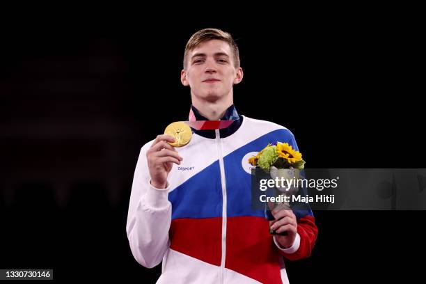 Gold medalist Maksim Khramtcov of Team ROC poses with the gold medal for the Men's -80kg Taekwondo on day three of the Tokyo 2020 Olympic Games at...