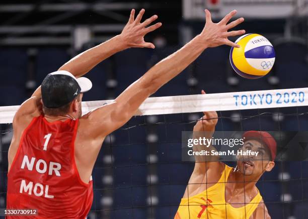 Pablo Herrera Allepuz of Team Spain competes against Anders Berntsen Mol of Team Norway during the Men's Preliminary - Pool A beach volleyball on day...