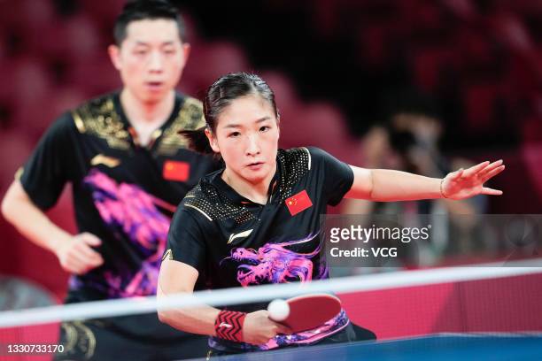 Xu Xin and Liu Shiwen of China compete against Jun Mizutani and Mima Ito of Japan in the Mixed Doubles Gold Medal Match on day three of the Tokyo...