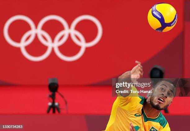 Lucarelli Souza Ricardo of Team Brazil serves against Team Argentina during the Men's Preliminary Round - Pool B volleyball on day three of the Tokyo...