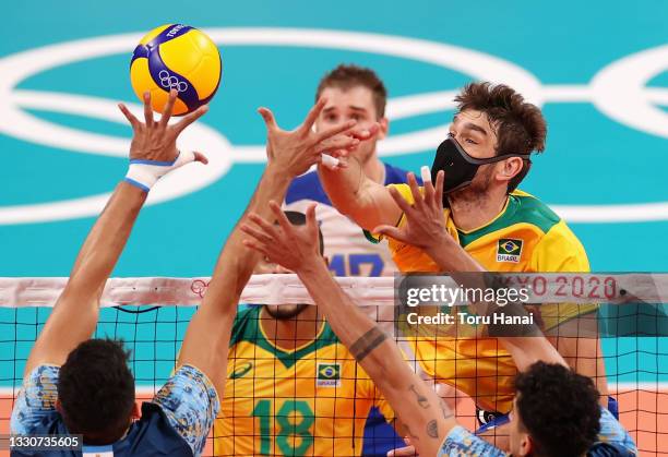 Lucas Saatkamp of Team Brazil competes against Team Argentina during the Men's Preliminary Round - Pool B volleyball on day three of the Tokyo 2020...