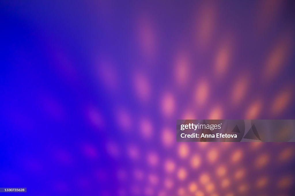 Blurred colorful neon background with abstract shadows and lights pattern. Copy space for your design. Trendy colors of the year.