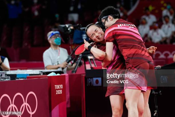 Jun Mizutani and Mima Ito of Japan celebrate after winning the Mixed Doubles Gold Medal Match against Xu Xin and Liu Shiwen of China on day three of...