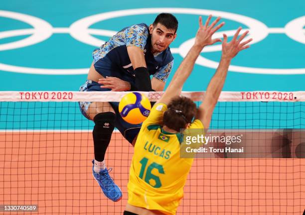 Ezequiel Palacios of Team Argentina competes against Lucas Saatkamp of Team Brazil during the Men's Preliminary Round - Pool B volleyball on day...