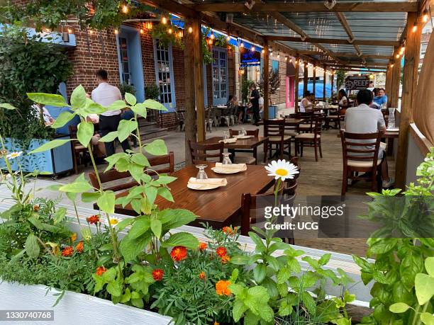 Outdoor dining in New York City extended for another year, REEF restaurant, Queens, NY.