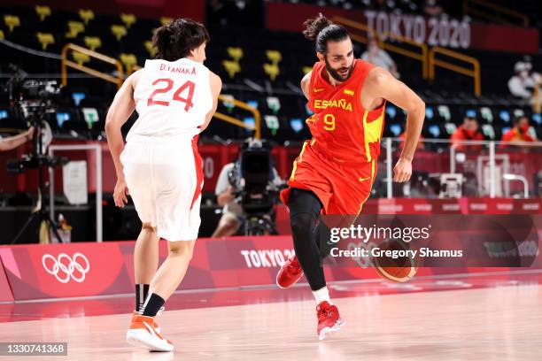 Ricky Rubio of Team Spain dribbles behind his back as he drives past Daiki Tanaka of Team Japan during the second half of the Men's Preliminary Round...