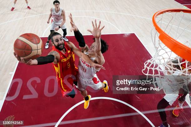 Ricky Rubio of Team Spain drives to the basket for a layup against Yudai Baba of Team Japan during the second half of the Men's Preliminary Round...