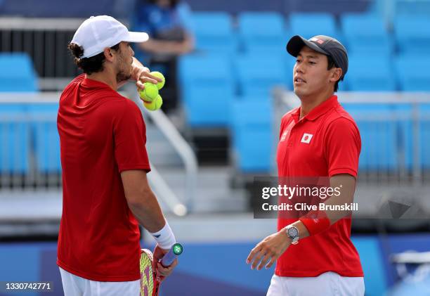 Kei Nishikori of Team Japan and Ben McLachlan of Team Japan as they play Jamie Murray of Team Great Britain and Neal Skupski of Team Great Britain in...