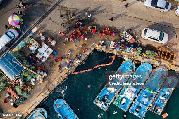 aerial view of fishing boats in jeongja harbor - ulsan stock pictures, royalty-free photos & images