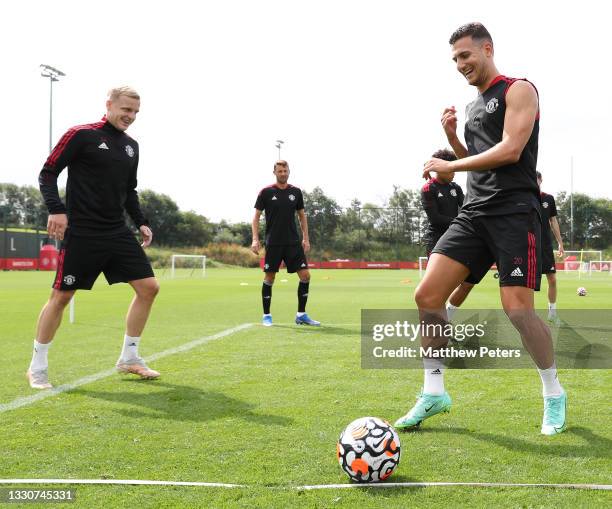 Donny van de Beek and Diogo Dalot of Manchester United in action during a first team training session at Carrington Training Ground on July 26, 2021...