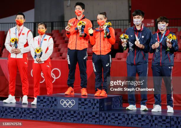 Xu Xin and Liu Shiwen of Team China, Ito Mima and Jun Mizutani of Team Japan, and Lin Yun Ju and Cheng I Ching of Team Chinese Taipei, pose for...