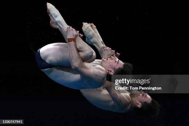 Tom Daley and Matty Lee of Team Great Britain compete in the Men's Synchronised 10m Platform Final on day three of the Tokyo 2020 Olympic Games at...