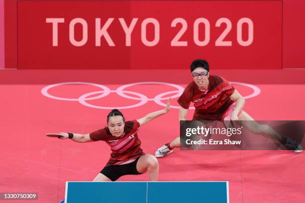 Ito Mima and Jun Mizutani of Team Japan in action during their Mixed Doubles Gold Medal match on day three of the Tokyo 2020 Olympic Games at Tokyo...