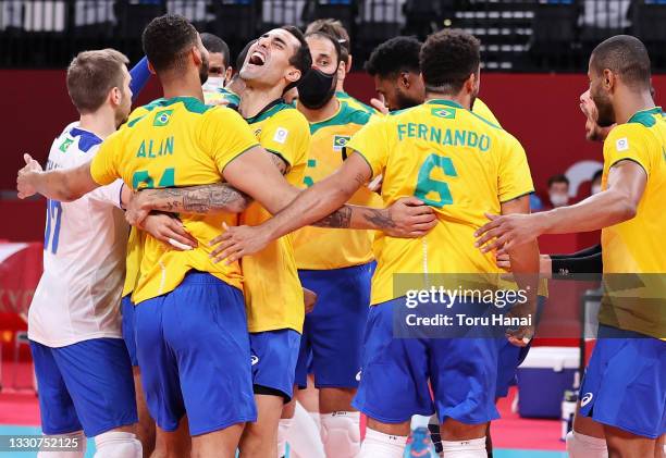 Players of Team Brazil celebrate defeating Team Argentina during the Men's Preliminary Round - Pool B volleyball on day three of the Tokyo 2020...