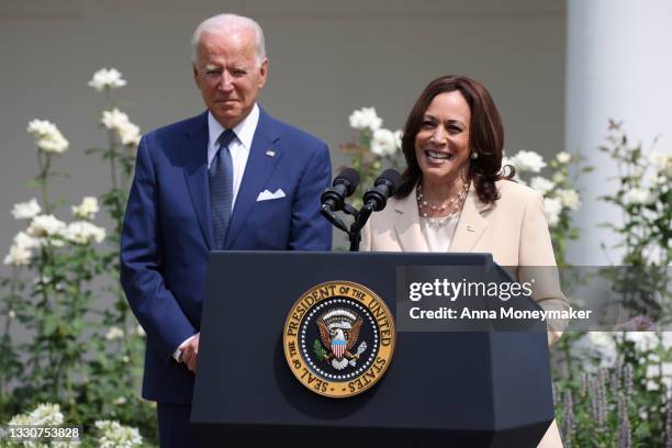 Vice President Kamala Harris delivers remarks as U.S. President Joe Biden looks on in the Rose Garden of the White House on July 26, 2021 in...