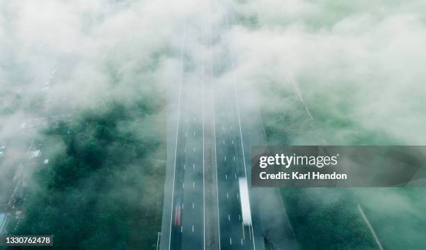 an elevated view of a uk motorway at dawn - stock photo - lorry uk photos et images de collection