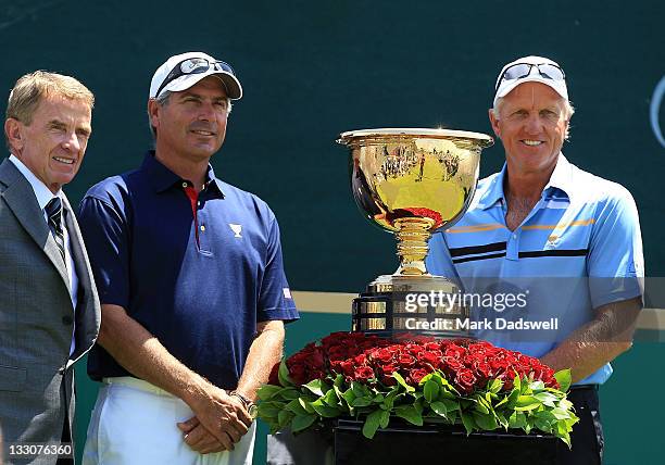 Commissioner Tim Finchem, U.S. Team captain Fred Couples and International Team captain Greg Norman stand alongside the Presidents Cup on the first...