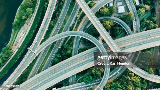 an aerial daytime view of a uk motorway intersection - stock photo - interstate stockfoto's en -beelden