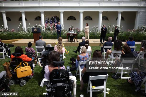 Artist Tyree Brown speaks in the Rose Garden of the White House as U.S. Vice President Kamala Harris and U.S. President Joe Biden look on, on July...