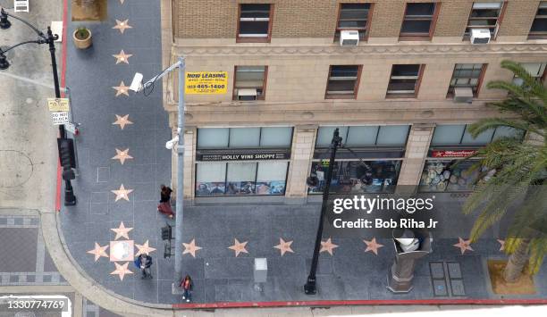 View of Hollywood Walk of Fame stars on sidewalk at the intersection of Hollywood and Vine, one of tinseltown's most famous intersections, May 8,...