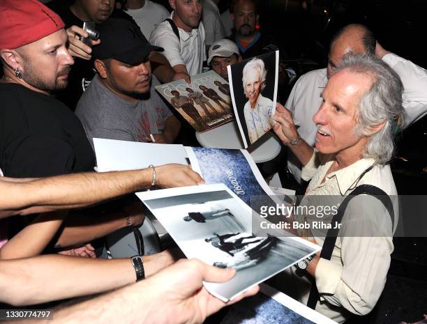 The DOORS legendary drummer John Densmore signs autographs for fans outside hotel, August 17, 2012 in Los Angeles, California.