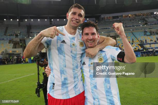 Emiliano Martinez and Lionel Messi of Argentina celebrate after winning the final of Copa America Brazil 2021 between Brazil and Argentina at...