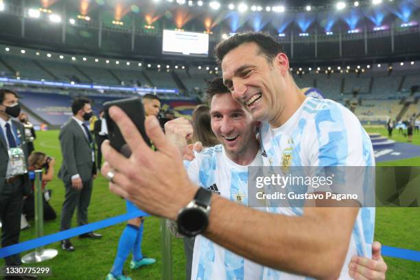 Head coach Lionel Scaloni and Lionel Messi of Argentina celebrate after winning the final of Copa America Brazil 2021 between Brazil and Argentina at...