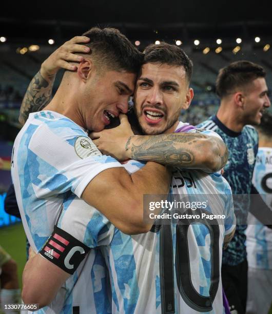 Joaquin Correa, Leandro Paredes and Lionel Messi of Argentina celebrate after winning the final of Copa America Brazil 2021 between Brazil and...
