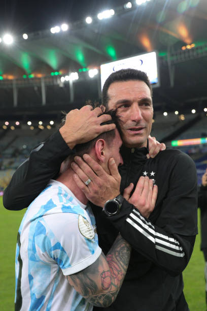Lionel Messi of Argentina celebrates with coach Lionel Scaloni after winning the final of Copa America Brazil 2021 between Brazil and Argentina at...