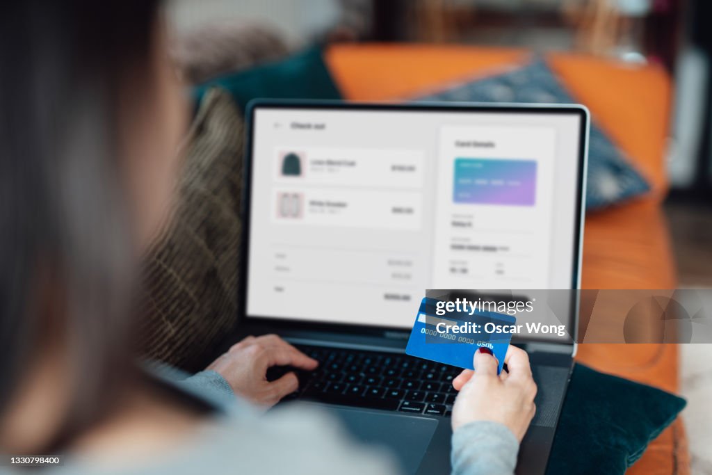 Woman using credit card for online shopping
