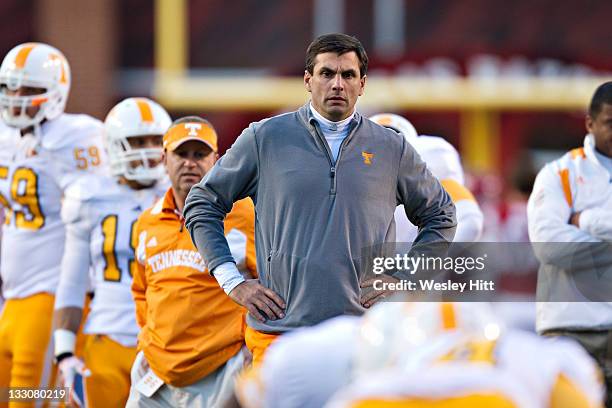 Head Coach Derek Dooley of the Tennessee Volunteers watches his team warm up before a game against the Arkansas Razorbacks at Donald W. Reynolds...