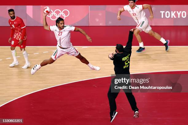 Mohamed Ali of Team Bahrain stops a shot on goal from Andre Gomes of Team Portugal during the Men's Preliminary Round Group B match between Bahrain...