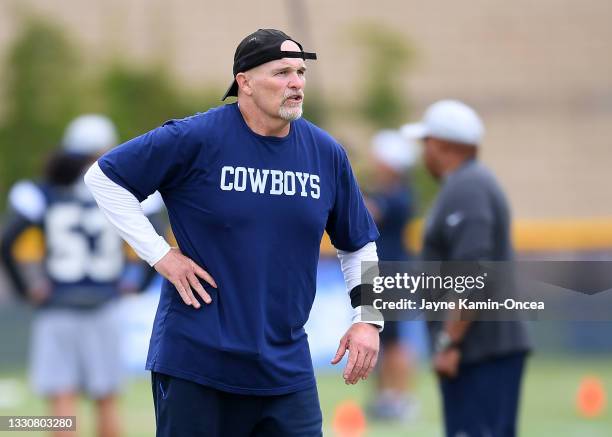 Defensive coordinator Dan Quinn of the Dallas Cowboys encourages players during training camp at River Ridge Complex on July 24, 2021 in Oxnard,...