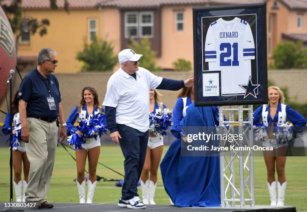 Owner Jerry Jones of the Dallas Cowboys presents a gift to the city of Oxnard to the Mayor, John C. Zaragoza, for $10,000 as they welcome fans to...