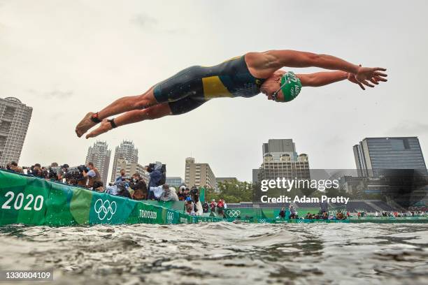 Emma Jeffcoat of Team Australia dives into the water during the Women's Individual Triathlon on day four of the Tokyo 2020 Olympic Games at Odaiba...